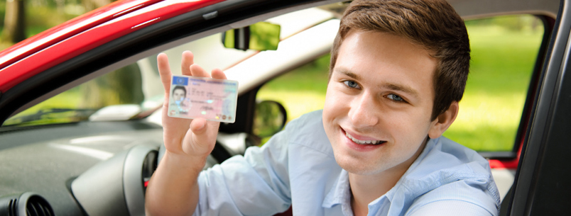 Contact Us: Picture of a boy showing his driving license